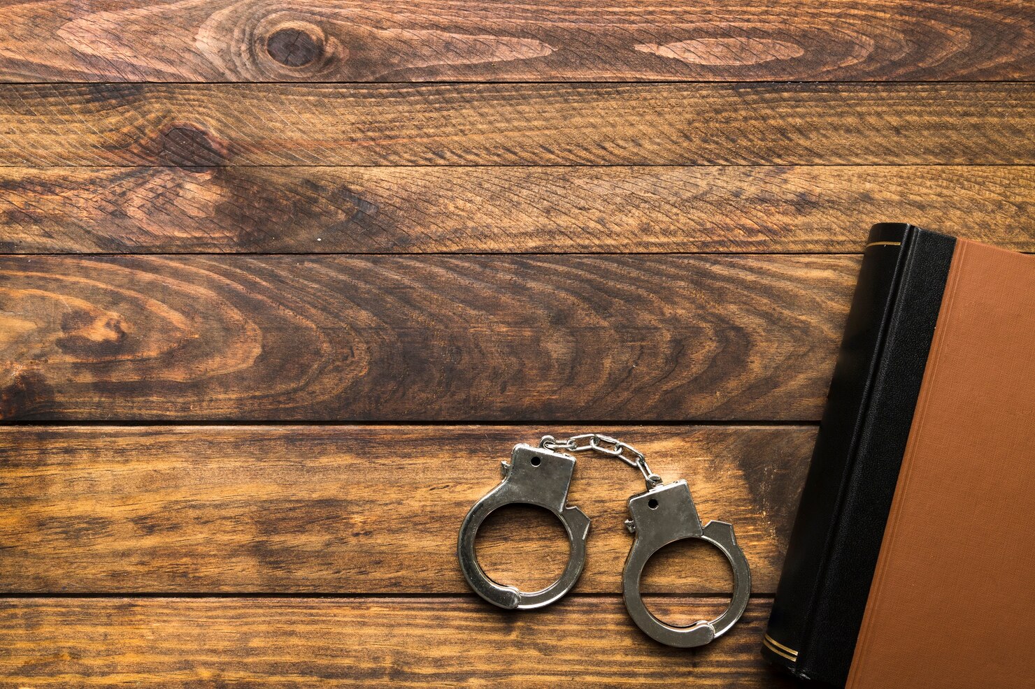 frame with book handcuffs copy space 23 2148230091